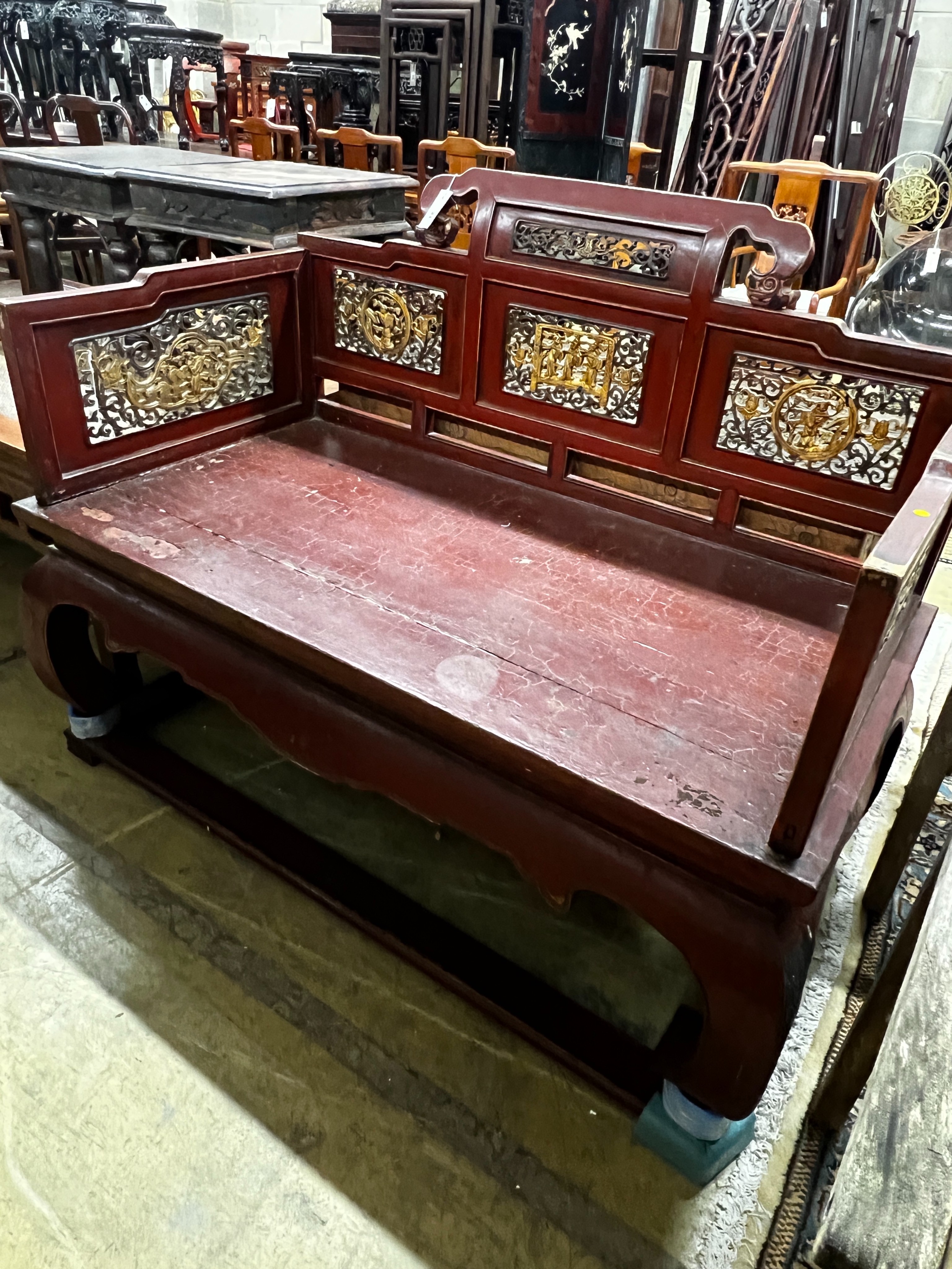 A Chinese scarlet lacquer parcel gilt bench, length 125cm, depth 70cm, height 97cm
